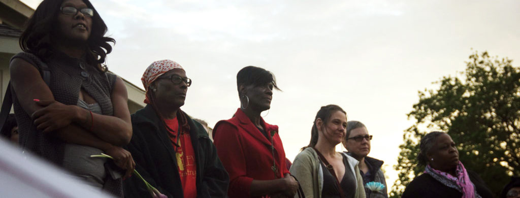 A group of people standing next to each other.