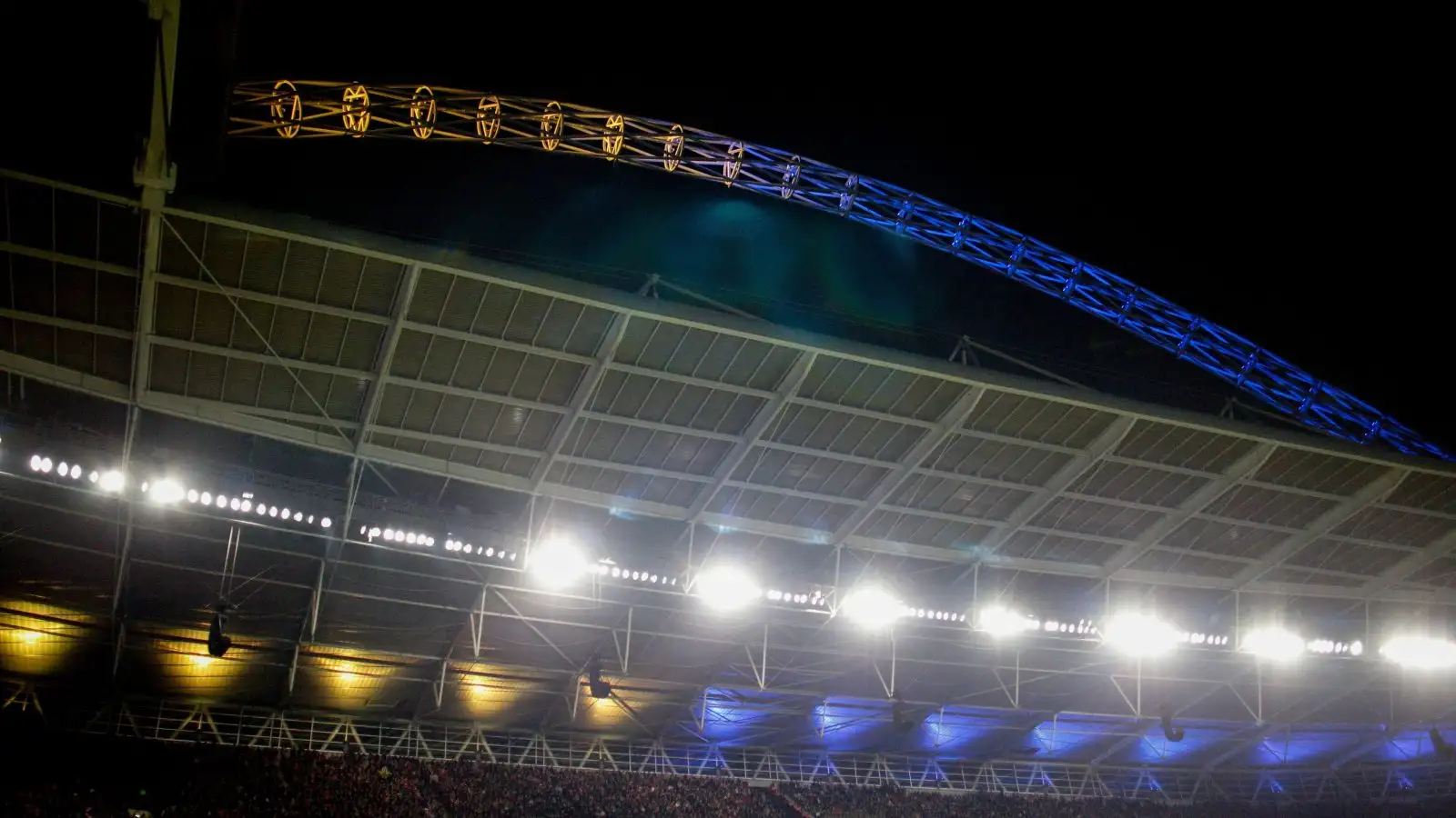The Wembley arch lights up in the colours of the Ukraine flag.