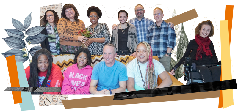 A group of Disabled people posing for a group photo, everyone has smiles on their faces.